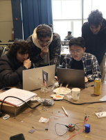 Students creating their programs for IDEA Hacks
